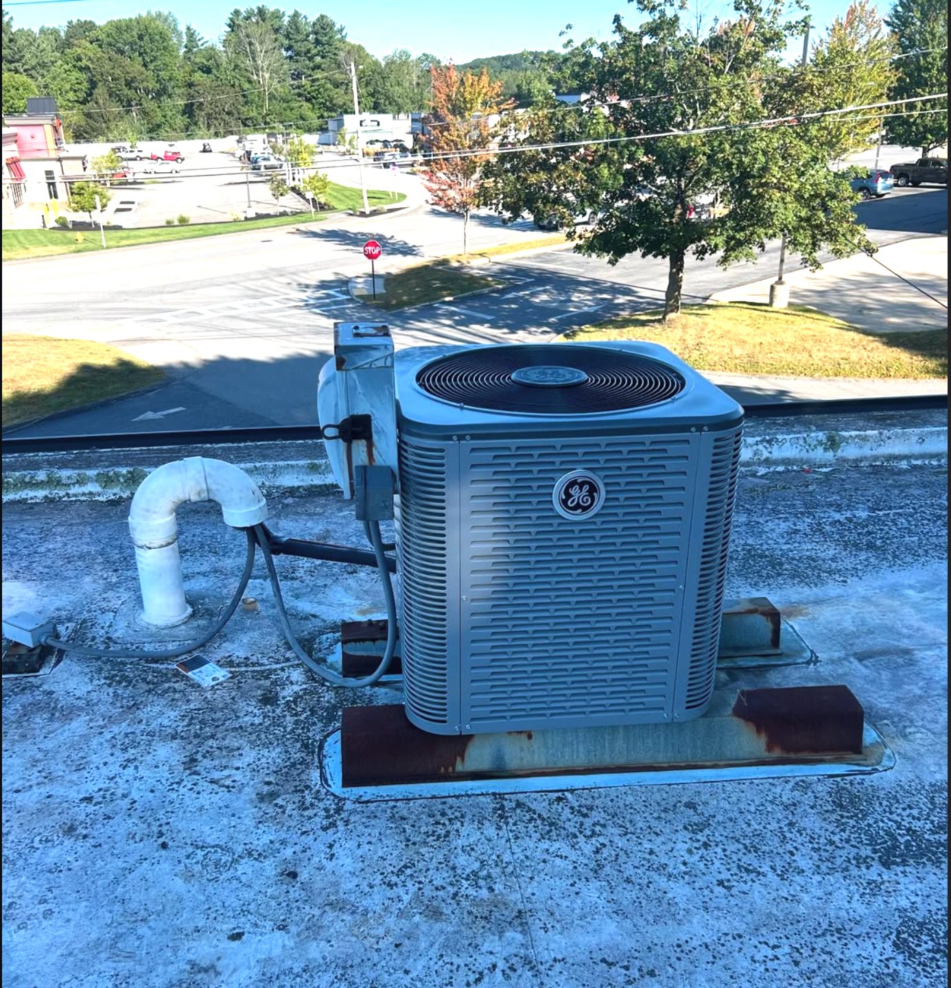 GE commercial HVAC condenser unit on rooftop