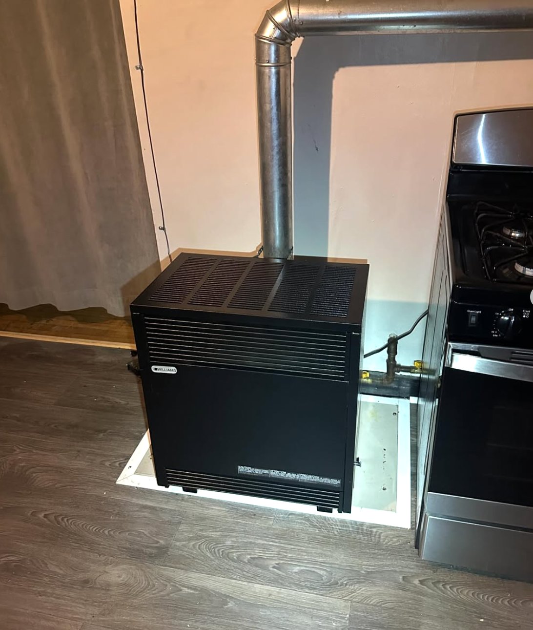 Williams wall furnace gas heating installation